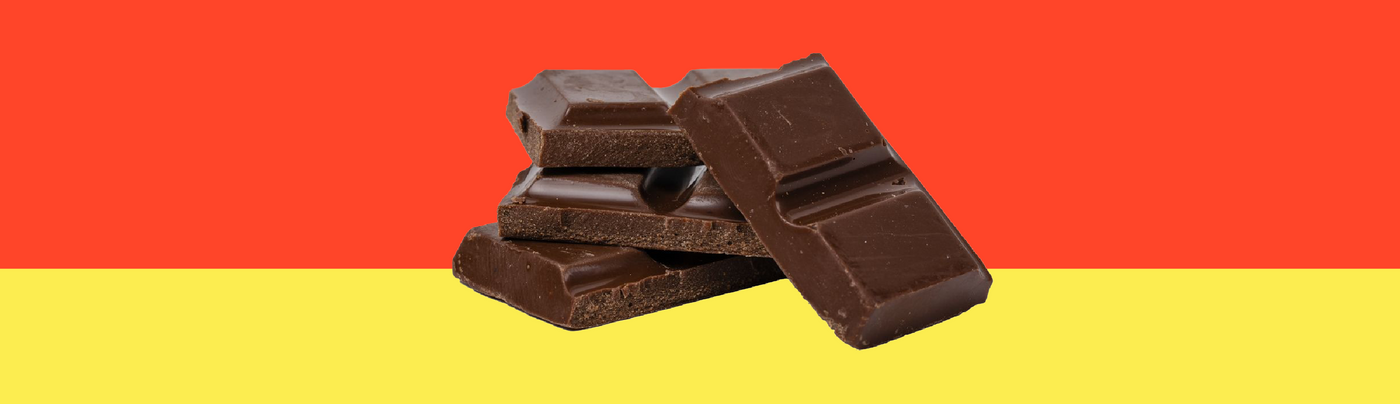 Image: Four squares of chocolate stacked.